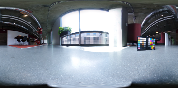 A 360 degree HDR panoramic of an office space with a color chart in the foreground